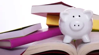 piggy bank and books